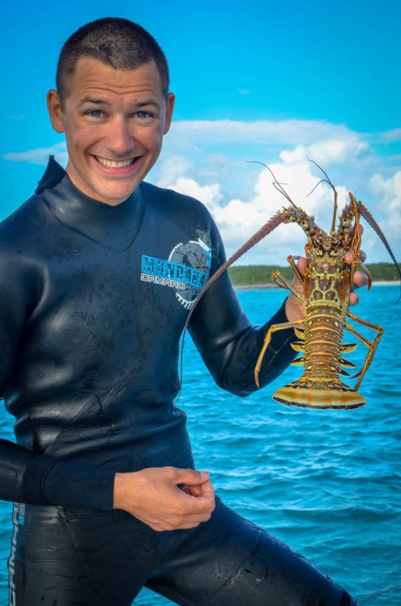 Spearfishing for lobster in the Bahamas. Exuma Island Chain, Bahamas.